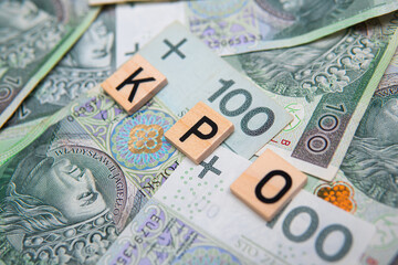 Inscription KPO which is Krajowy Plan Odbudowy next to Polish Money. Concept showing Next...