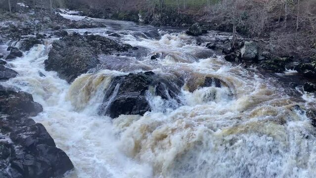River Dee fast flowing due to high water level during the winter at the Bridge of Feugh
