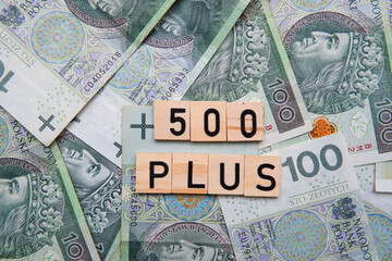 inscription 500 plus next to polish money. 500 plus is a state program in the field of social policy
