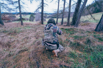 Member of the international legion - sniper protects the occupied territory of the territory.