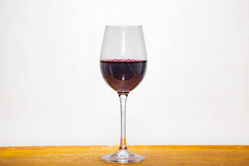Glass of red wine in white background and selective focus