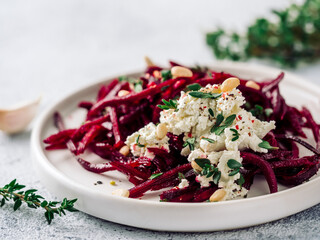 Raw beetroot spaghetti salad with soft cheese, nuts, thyme. Vegetable noodles - Fresh Beetroot...