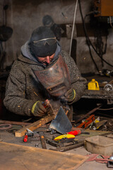 Welding process in the industrial workshop by worker