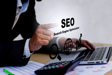 Businessman using a computer for analysis SEO Search Engine Optimisation Marketing Ranking Traffic...