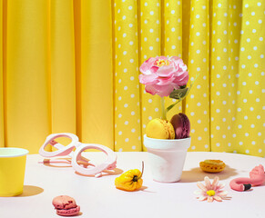 Still life idea, yellow aesthetic, floral and food elements. 