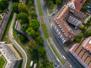 Fototapeta na wymiar Aerial top view of the Neutorgraben street with railway tram tracks and houses surrounding, Nuremberg, Germany