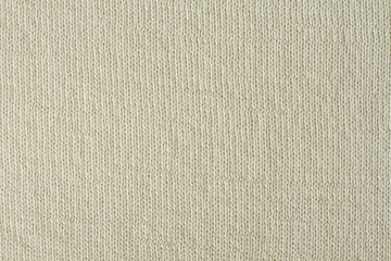 Vanilla color knitted cotton fabric texture. Macro.
