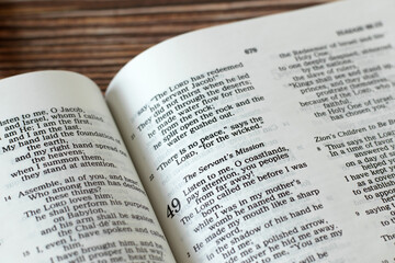 Servant's mission biblical verses in open holy bible book. Jesus Christ's forgiveness, salvation, and love concept. A closeup. - obrazy, fototapety, plakaty