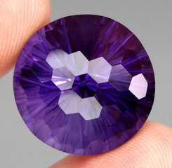 Natural stone purple amethyst on a gray background