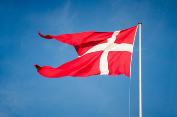 DeDanish flag on a flagpole.