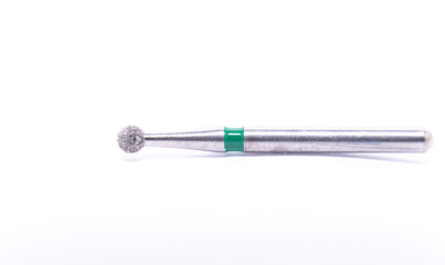 Diamond dental burs in close-up isolated against a white background. Dental tools for removing cavities and treating teeth. Teeth drilling.