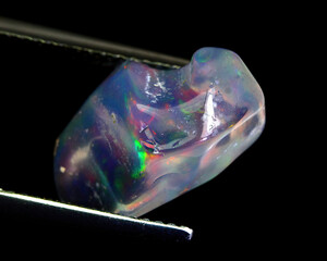 Natural beautiful gemstone opal on gray background