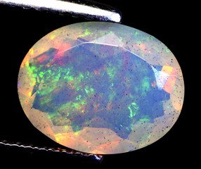 Natural beautiful gemstone opal on gray background