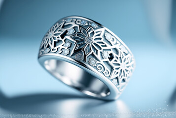 Silver ring with a winter snowflake design against a blue blurred bokeh background, created with Generative AI