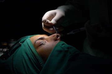 rhinoplasty surgery, defects in the shape of the nose in the female patient. Surgical intervention in plastic surgery rhinoplasty 