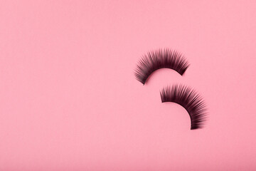 False eyelashes on a pink background. Flatley. Beauty and fashion concept. Eyelash extension....