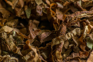 Crushed tobacco leaf close-up. macro photography. slow motion closeup