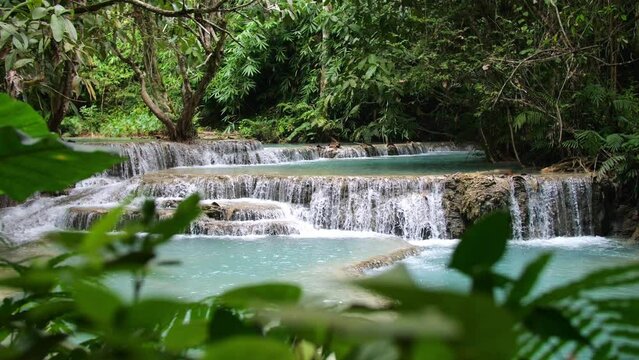 Beautiful Clear Waterfall Cascade In Tropical Rainforest, Kuang Si Falls In Luang Prabang, Laos
