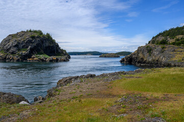 Fototapeta na wymiar View of an ocean passage between rocky shorelines