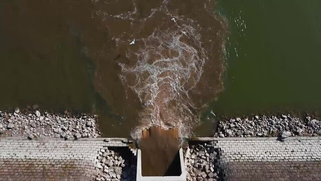 Footage of a sewage being dumped into the river