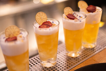beautiful and delicious alcoholic cocktails prepared at the bar by the bartender.