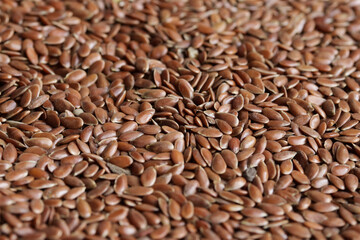 Flaxseed or linseed background and texture. Concept of ingredients, seeds and health foods.