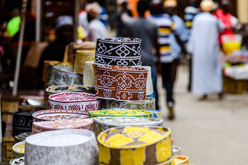 African traditional hats kofias for sale at the bazaar market in Stone town. Zanzibar island,...