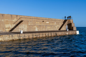 Looking for Dolphins from the Harbour Wall on the Moray Coast