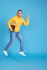 Fototapeta premium young happy man in casual clothes jumping