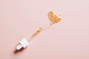 Serum pipette and Drop with gold particles, gel in the form of a heart, cream mask, gel, hyaluron