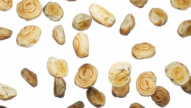 Looping animation featuring a cloud of Cinnamon Scrolls falling endlessly on a featureless white background.