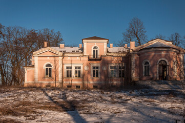 Fototapeta na wymiar Exterior of an abandoned old historic palace mansion in Poland in Central Europe