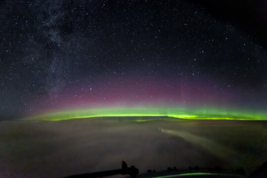 Northern Lights, Aurora Borealis seen from the cockpit above Norway