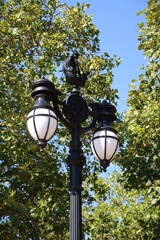 Historic street lamp with sailing ship