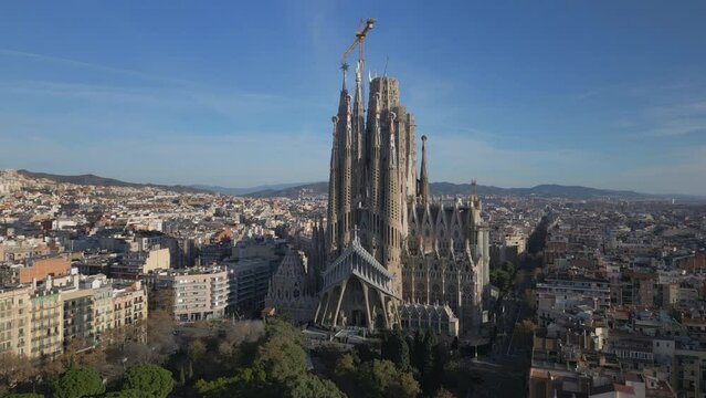 alt flying clockwise around Sagrada Familia cathedral in Barcelona Spain