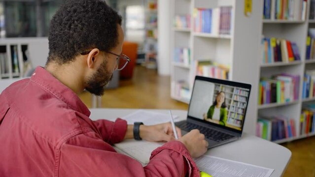 African American man, smart postgraduate student online consulting his teacher by video link