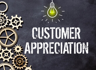 Customer Appreciation text written on a notebook with pencils