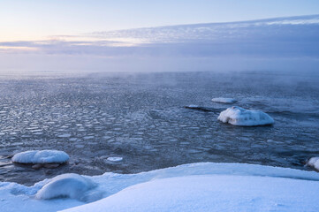 View of the frozen sea and snowy beach. Pörkenäs, Finland.