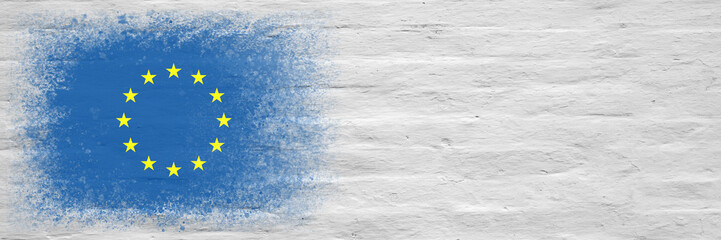 Flag of European Union. Flag painted on a white plastered brick wall. Brick background. Copy space. Textured background