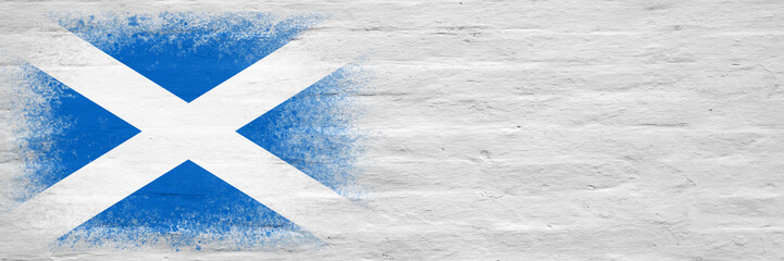 Fototapeta na wymiar Flag of Scotland. Flag painted on a white plastered brick wall. Brick background. Copy space. Textured background