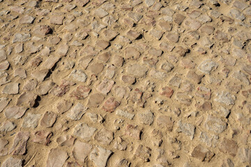 A road covered with granite tiles as a background.