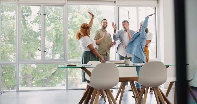 Business, diversity, team and huddle and high five to celebrate winning achievement, success and collaboration. Startup, teamwork and celebration together, congratulations at meeting in modern office