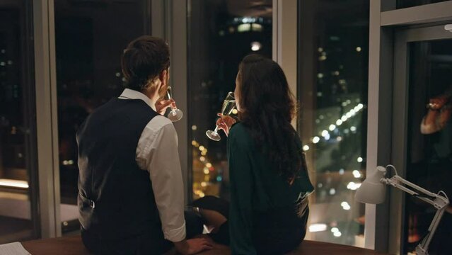 Man seducer flirting woman drinking champagne. Couple in love talking sitting.