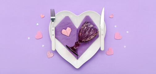 Beautiful table setting for Valentine's Day on lilac background