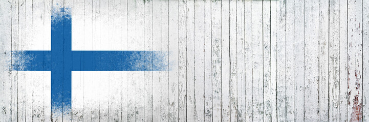 Flag of Finland. Flag is painted on a white wooden surface. Wooden background. Plywood surface. Copy space. Textured background © Alex Puhovoy