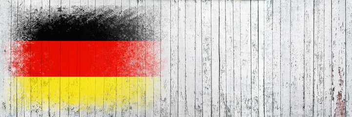 Flag of Germany. Flag is painted on a white wooden surface. Wooden background. Plywood surface. Copy space. Textured background