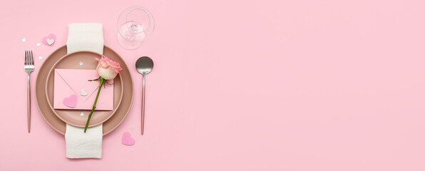 Beautiful table setting for Valentine's Day with letter on pink background with space for text