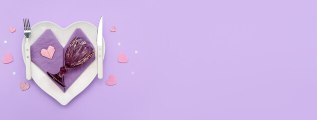 Beautiful table setting for Valentine's Day on lilac background with space for text