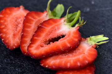 Strawberry slices on grey background