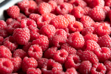 natural fruit background of fresh raspberries top view, texture of berries